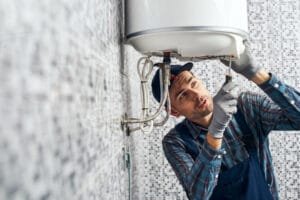 A DC Drains plumber servicing a Costa Mesa water heater